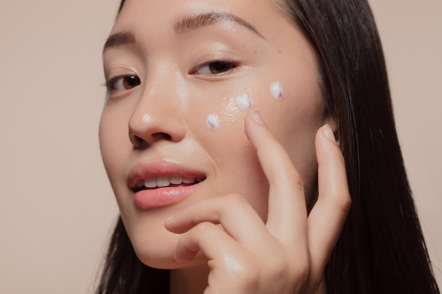 Model with three product dots on face