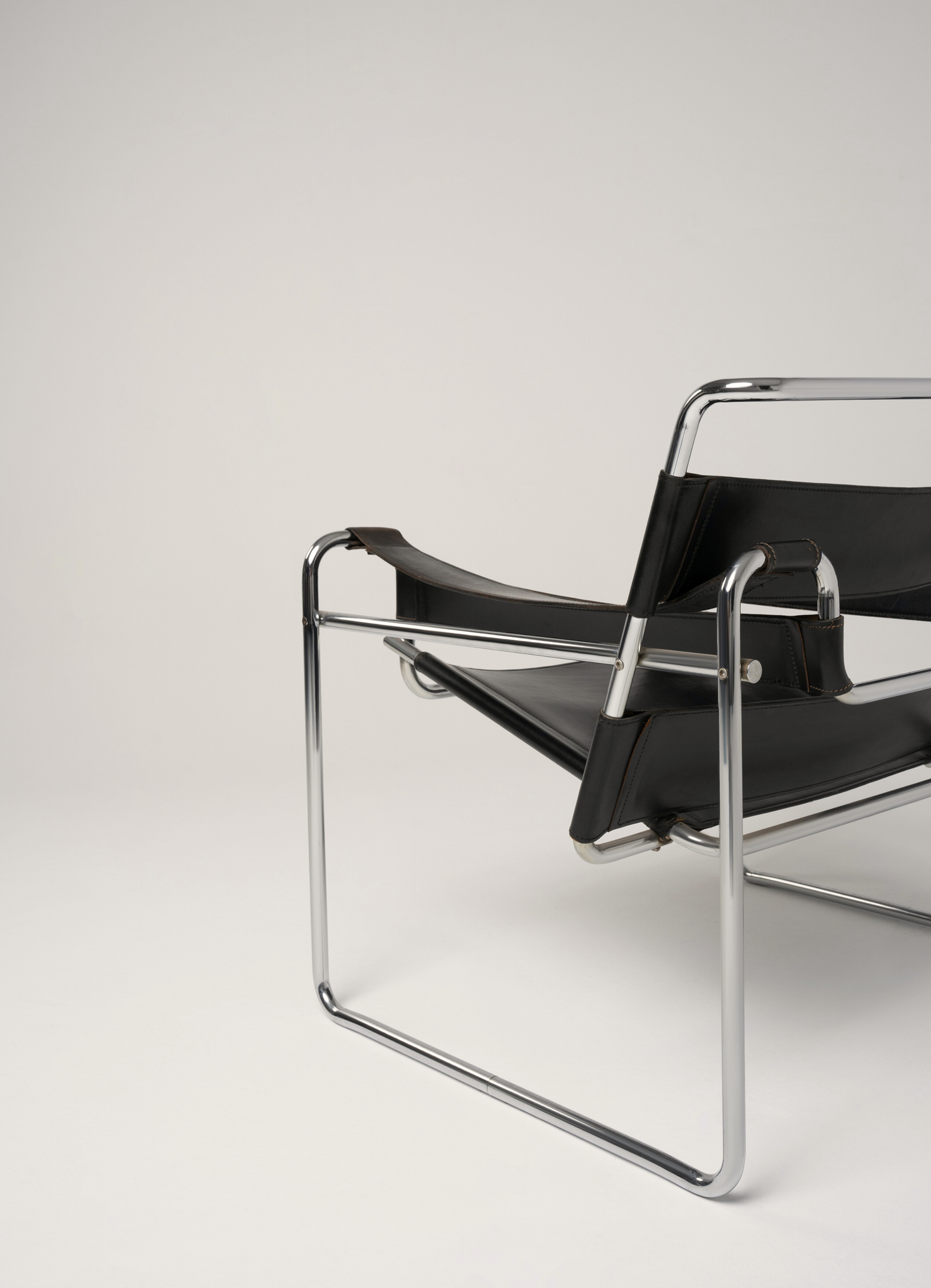 Black metal chair with a neutral background
