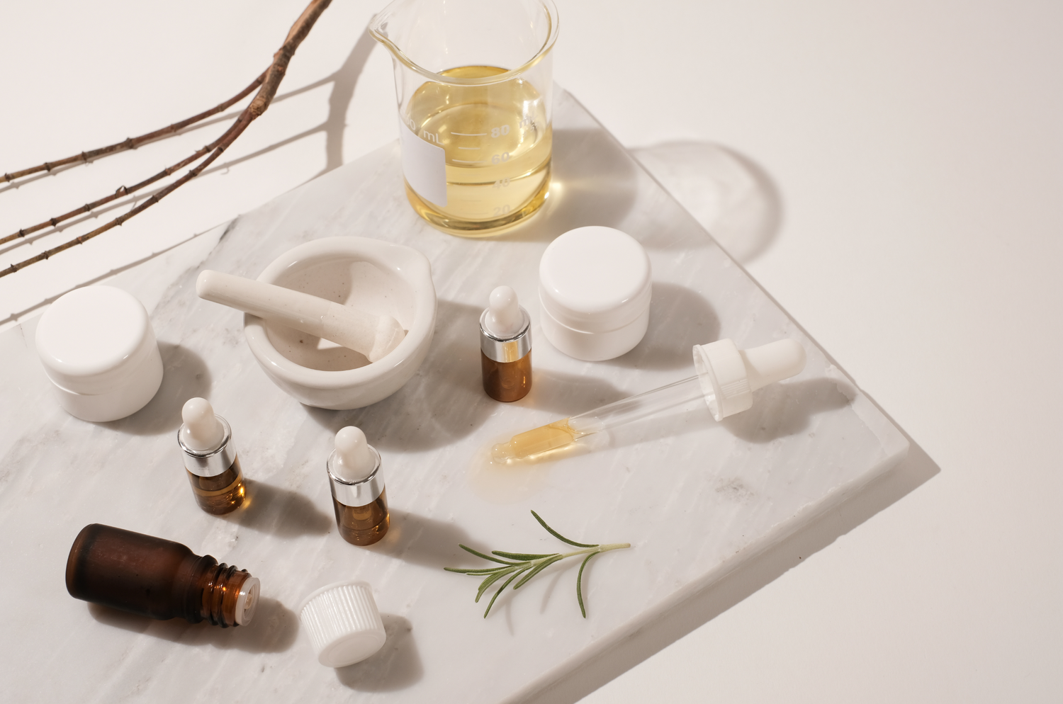 Product packaging on a white marble cutting board surrounded by ingredients 